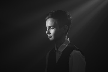 Portrait of a beautiful teenager in strict clothes with authentic appearance in vintage style