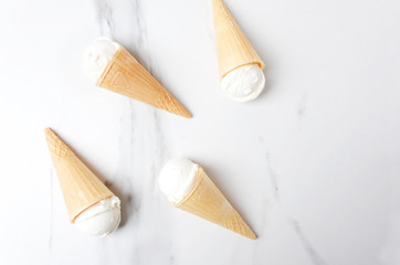 Top view of vanilla ice cream in waffle cones.Tasty summer food