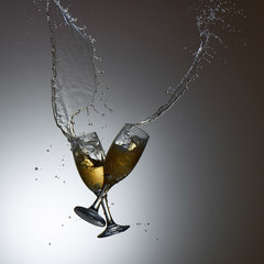 Collision of two glasses with splash