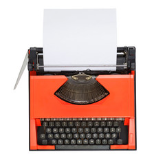 Red typewriter isolated on white