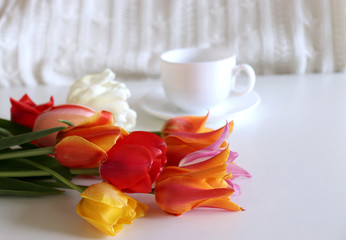 Bouquet of flowers tulips and coffee. Concept for Valentine's Day or Women's Day or Mother's Day. Flat lay, top view.Empty space for your text.