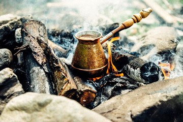 Making coffee in Turk at the campsite on an open fire