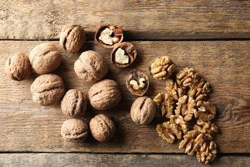 Tasty walnuts on wooden table