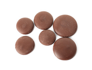 Delicious chocolate chips on white background