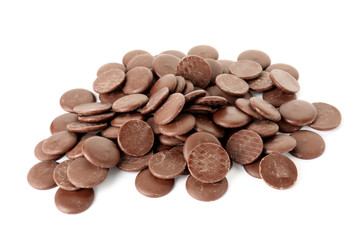 Delicious chocolate chips on white background