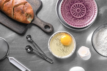 Bakery product with ingredients on table