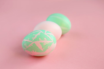 Fototapeta na wymiar Painted Easter eggs on color background