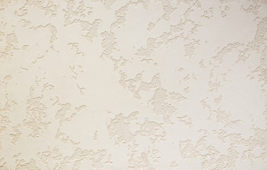 Photo of old gray cement wall with fractures.