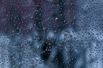 drops on broken glass. cold tone