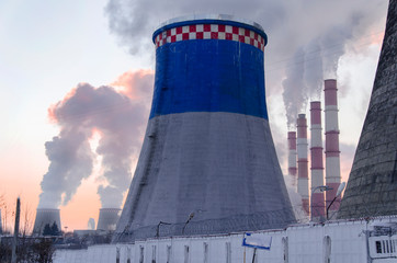 pipes of thermal power plant with smoke. maximum power