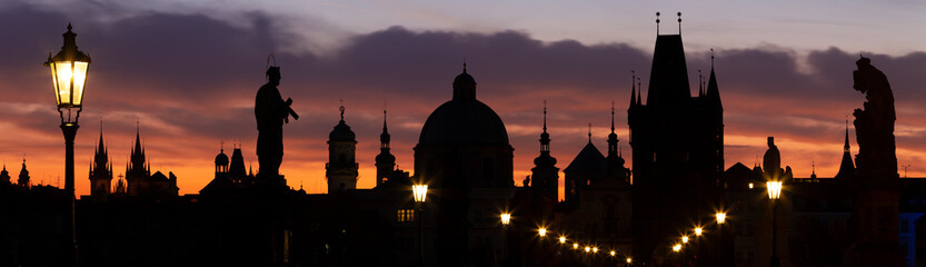 Fototapeta na wymiar Prague - The silhouette of Charles bridge in morning dusk.