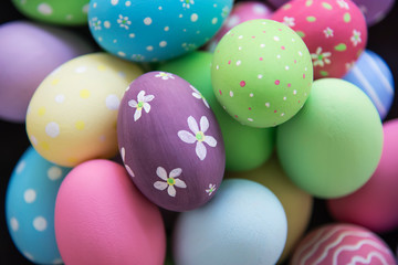 Fototapeta na wymiar Painted colorful Easter eggs background - Easter holiday celebration background concept