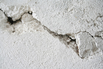 Cracked  white painted wall. Textured background