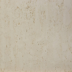 Photo of old gray cement wall with fractures.