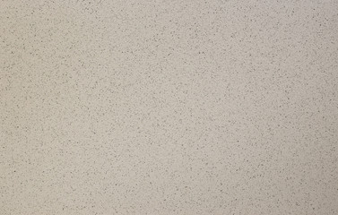 Photo of old gray cement wall with fractures.