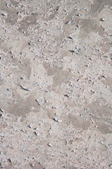 Old wall background with peeling white paint. Wall background