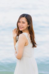 Portrait beautiful young asian woman happy and smile on the beach sea and ocean