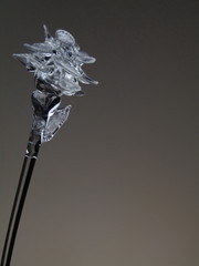 glass flower on gray background