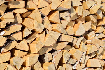 Laying of split birch firewood. Firewood. Fresh and light birch wood.
