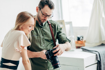 awesome girl selecting good photos for downloading them to the internet, close up photo. copy space successful photo