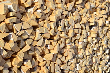 Laying of split birch firewood. Firewood. Fresh and light birch wood.