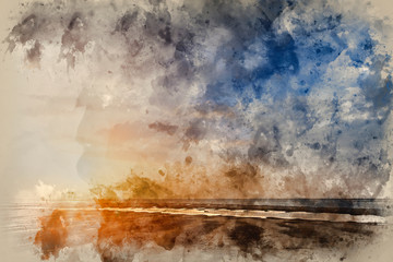 Beautiful vibrant Summer sunset over golden beach landscape