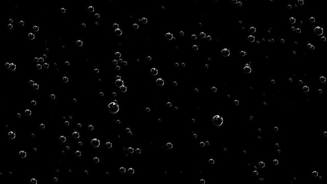 Realistic appearance of champagne bubbles on a black background.4k splash bubbles,float quicksilver mercury blisters,underwater drop transpiration,soda boiling,gases liquids water,beverages soft