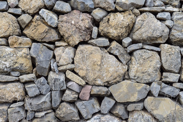 Fototapeta na wymiar Abstracción de una pared de piedra arreglada. España