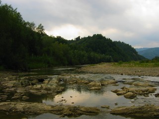 Beautiful mountain river with cascades on a summer day