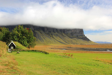Turf church in meadow Iceland