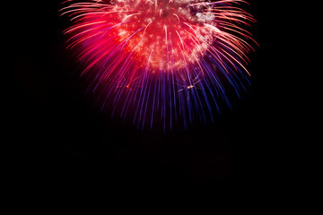 Awesome isolated Festive fireworks on a dark background. Can be used as wallpaper or background