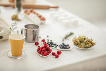 close up photo. yummy berries on the kithcen table, raspberries, blueberries. vitamin, health care