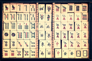 Top view of a box of antique Mahjong tiles