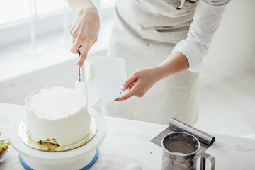 young woman using offset spatula. close up cropped photo