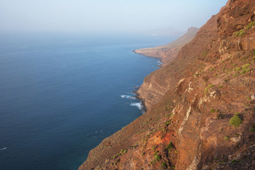 Scenic volcanic coastline landscape, Cliffs in Tamadaba natural park, Grand Canary island, Spain .