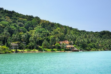 Tropical beach with tourist resorts on Koh Chang island, Thailand.