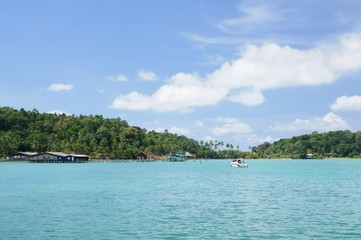 Tropical sea Bang Bao bay with boats, piers and tourist resorts on Koh Chang island, Thailand.