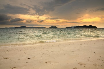 Sunset on the tropical sandy beach on the Koh Chang island in Thailand.