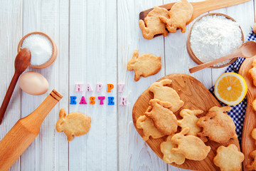 Happy Easter greeting. Baking Easter bunnies. Ingredients with Easter decoration