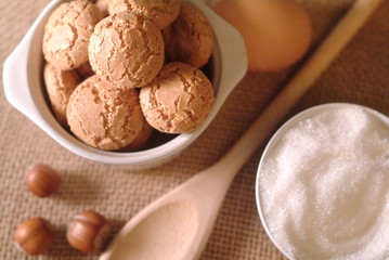 Traditional italian cookies Amaretti with sugar and hazelnuts.