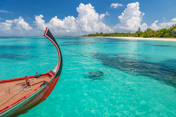 Wonderful scenery, Maldives island beach and sea with Dhoni boat. Exotic travel and vacation background of Maldives. Perfect island beach and sea view, Maldive
