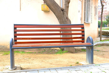 Wooden bench in the city park 