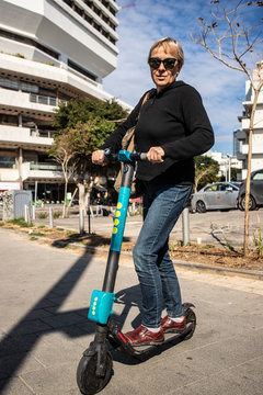 Woman With Escooter And Sunglasses