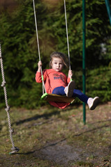 child on a swing