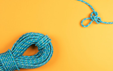 Rope and knot on pink background.