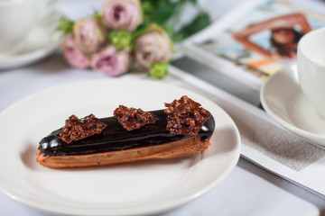 French dessert Eclair on white background