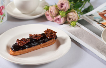 French dessert Eclair on white background