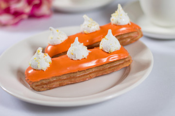 French dessert Eclair on white background