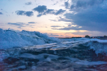 Fototapeta na wymiar Waves with sunset