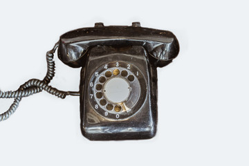 Old black telephone vintage di cut on white background.
